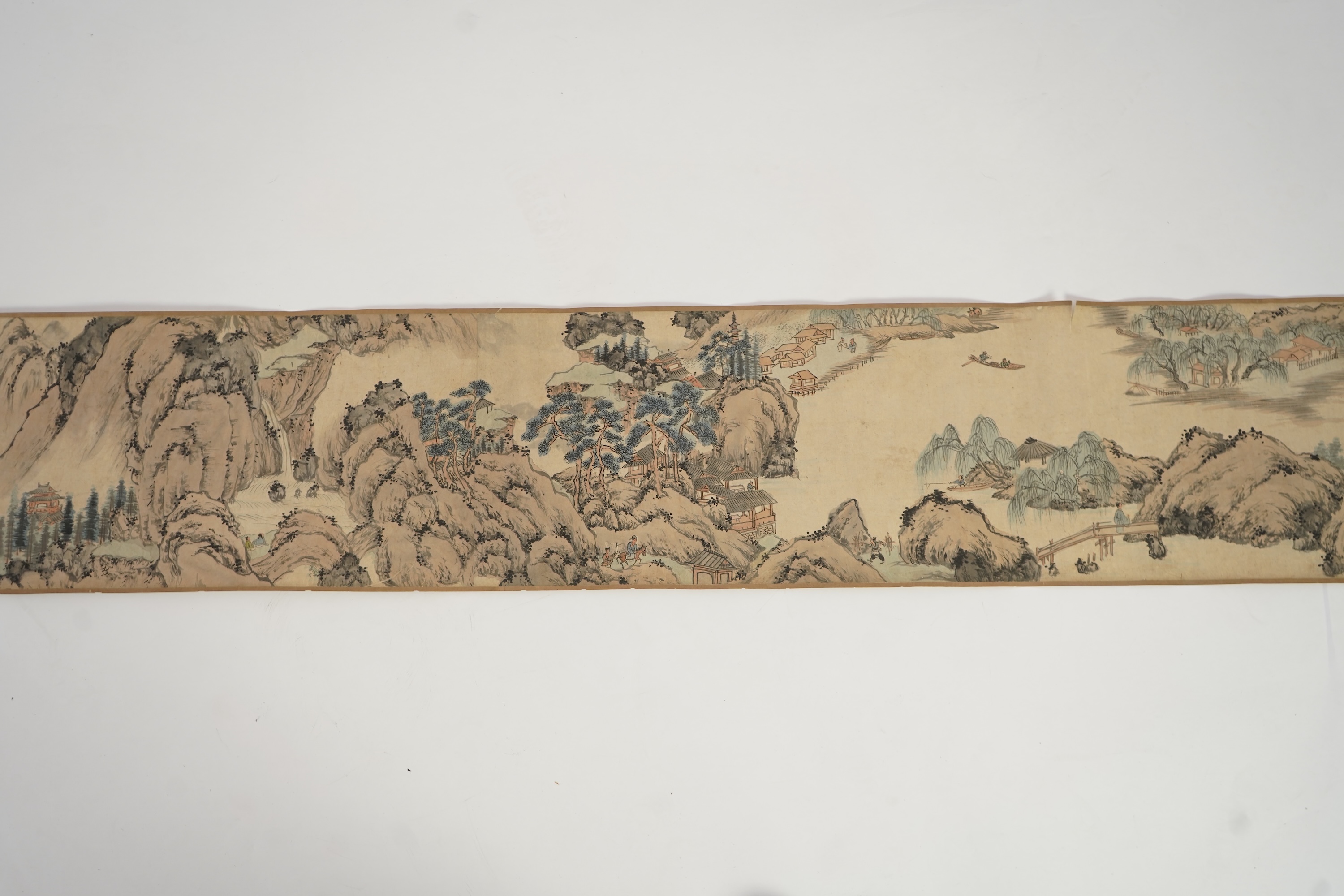 Chinese School , (Qing dynasty), Figures in a mountainous river landscape, Ink and colour on paper handscroll, 268.5cm x 29cm excluding borders